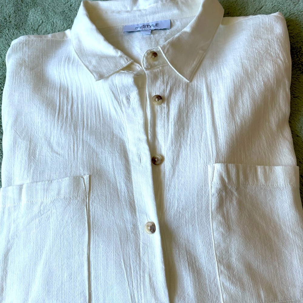 White blouse. Feels and looks like linen.